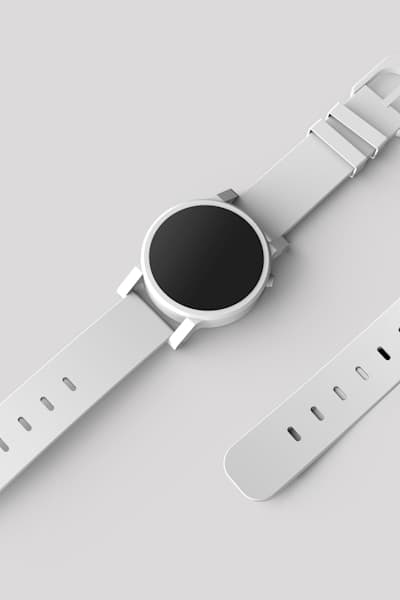 Modern white smartwatch with a black circular face